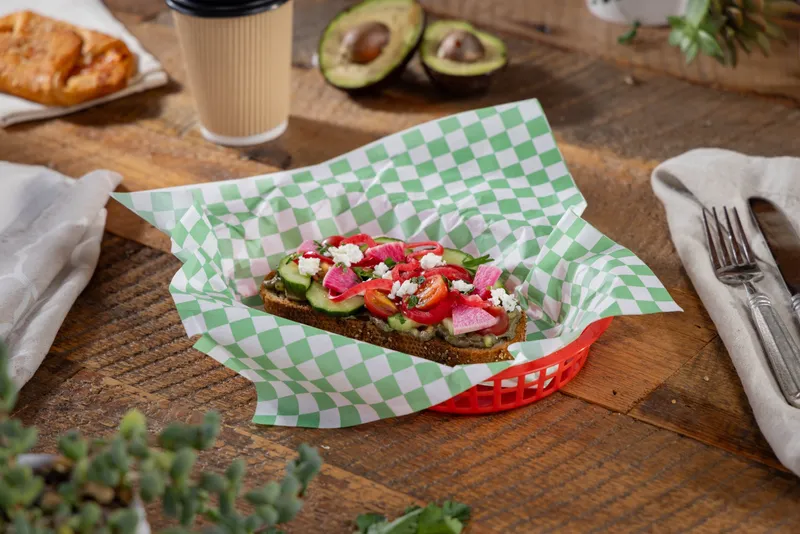 Avocado toast on fresh bread at Deli Nerds Costa Mesa