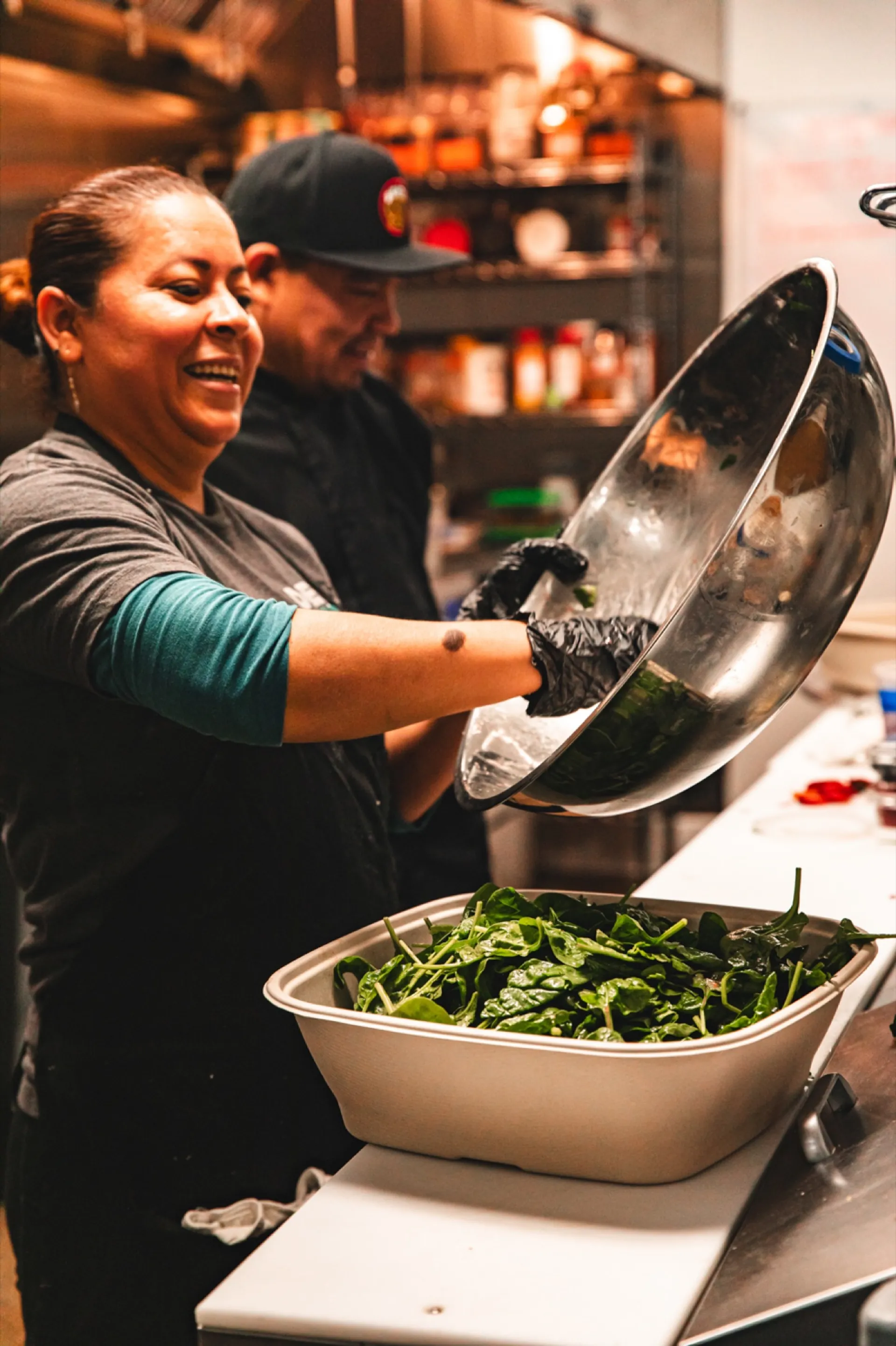 Diverse Deli Nerds kitchen team cooking from scratch in Costa Mesa